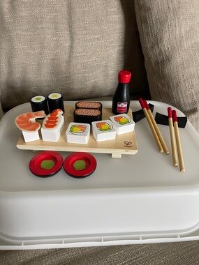 Hape Wooden Sushi Play Set Complete with Chopstick and soy sauce.
